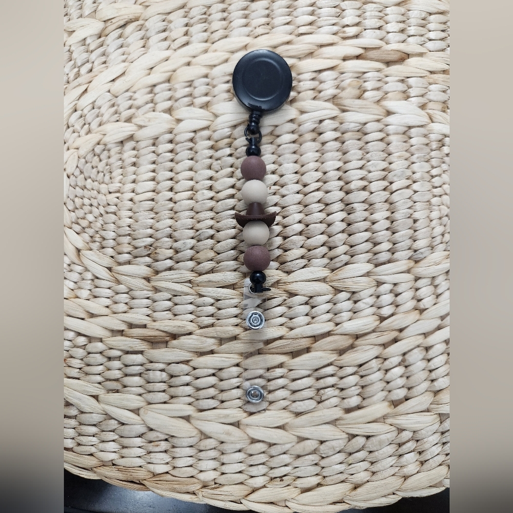 Beaded Black and Brown Badge Reel With A Cowboy Hat